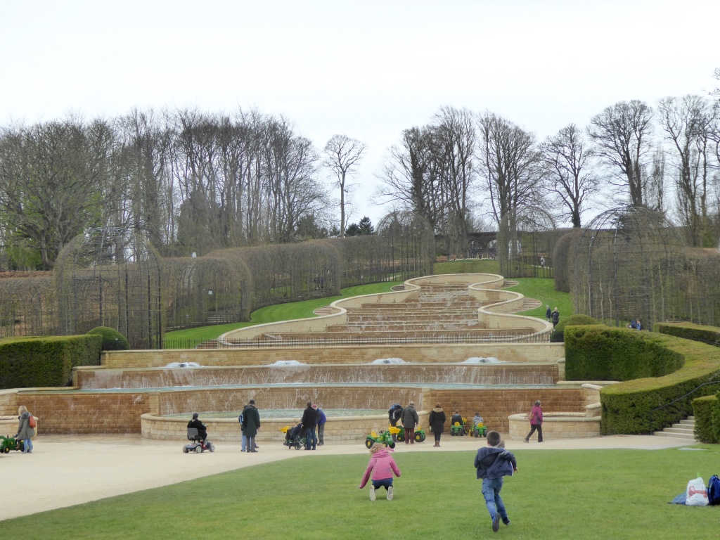 The Grand Cascade with children on tractors