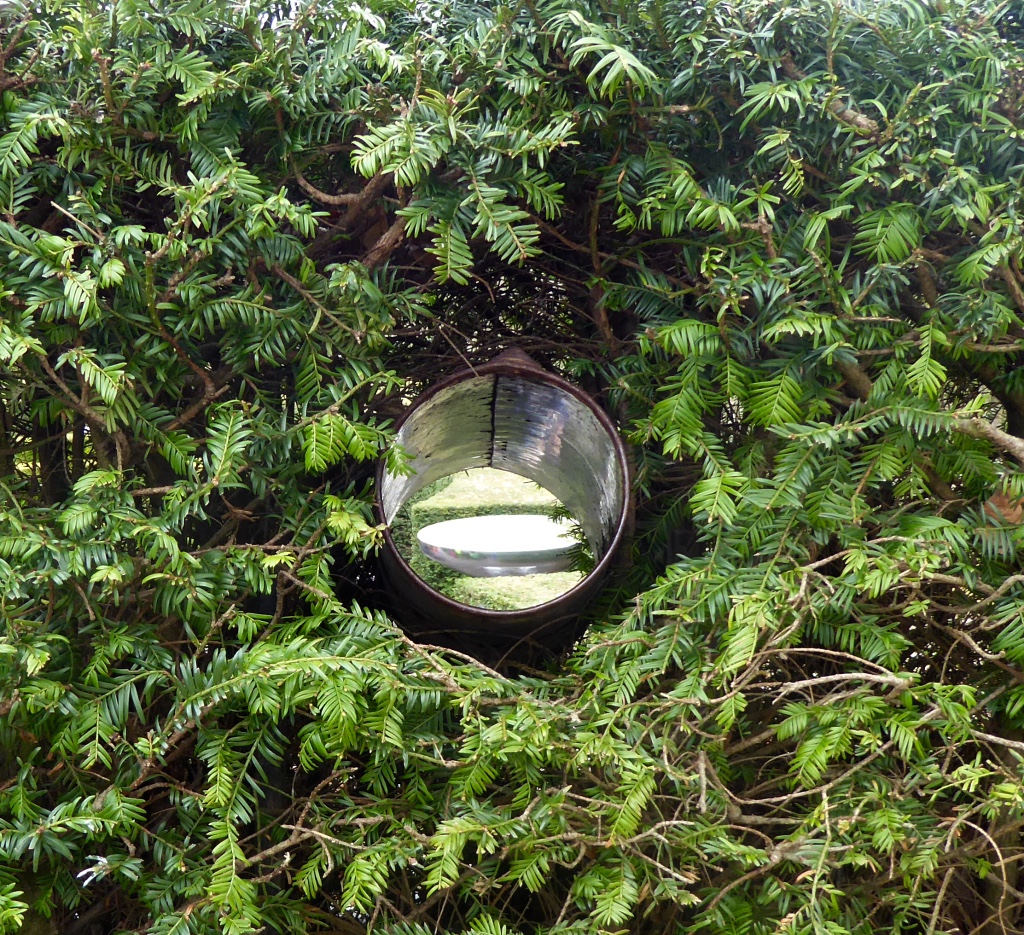 Tube in hedge featuring a water fountain