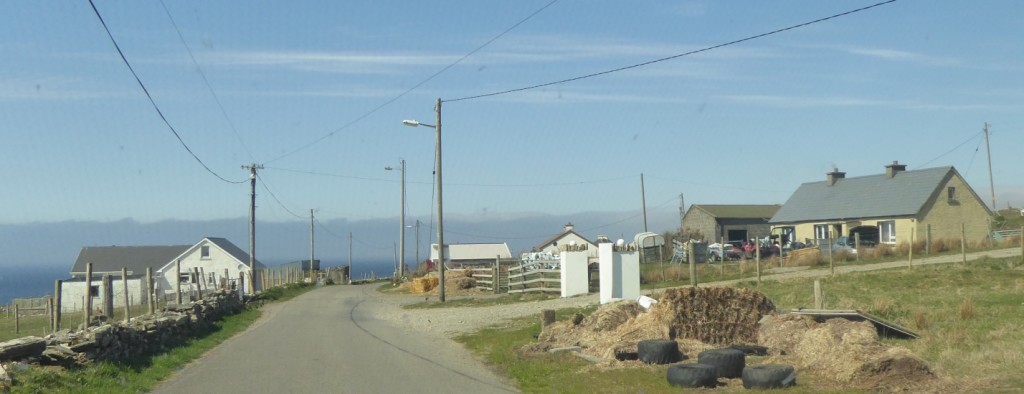 At the end of the road a godforsaken village on windswept hills with yards full of junk - Ed reckons they are wreckers